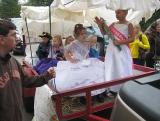 People gathered around a food-service table under a canopy at the 2009 New Albany Fall Festival.
