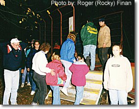 Getting in the hay wagon. This photograph is from the 1998 Haunted Hayride.