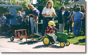 Peddle tractor pulls. This photograph is from the 1999 Fall Festival.