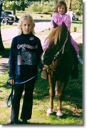 Pony rides. This photograph is from the 1999 Fall Festival.