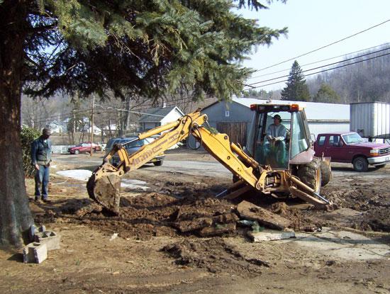 Mike and Myron working on water. This photograph is from the Community Volunteers.